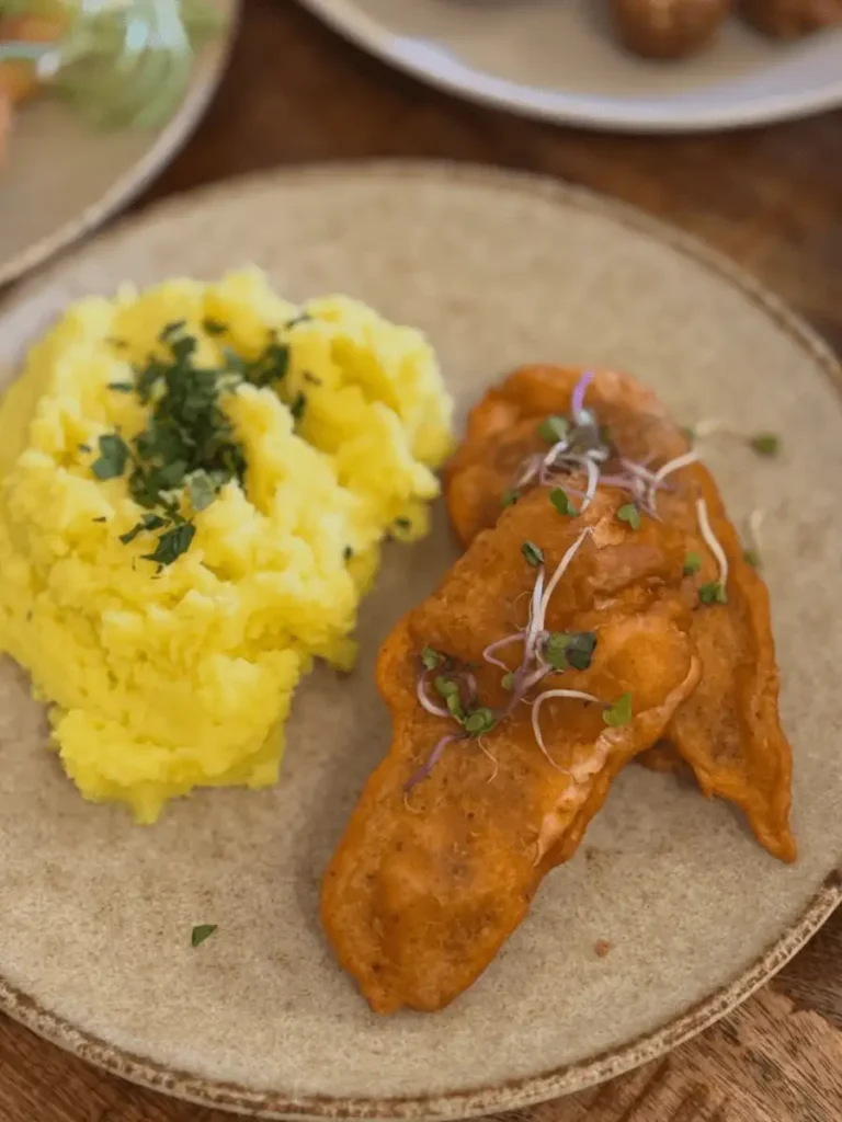 Main course from the lunch menu served with mashed potatoes in a restaurant in Plzeň